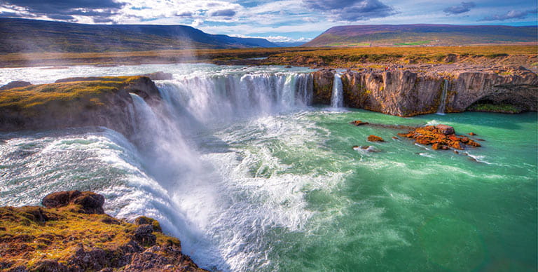 Goðafoss Waterfall in Iceland on a bright, sunny day